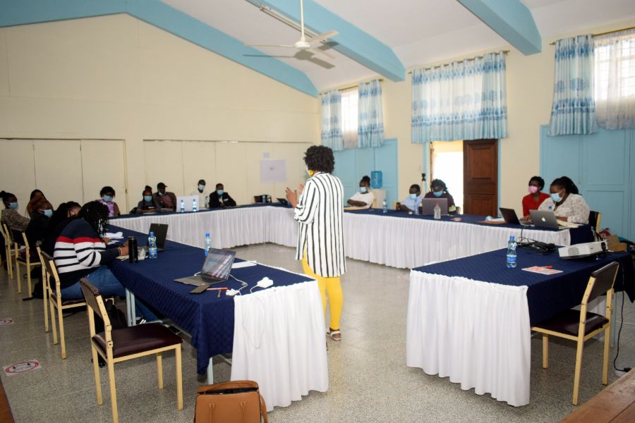 A facilitator speaking during one of the session as the participant listen in