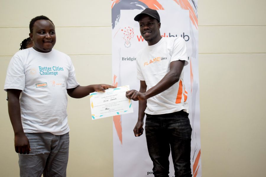 Better Cities Challenge certificate being received by a male participant