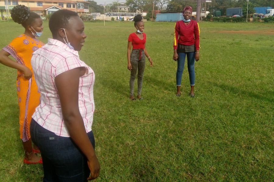 Participants standing outside the Busia Polytechnique grounds , where the Adili Baking training programme was held